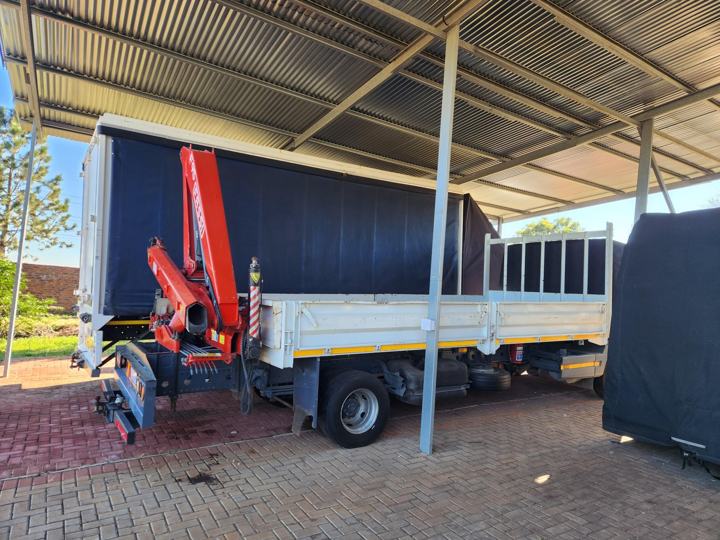 Crane truck under the Anchor Movers carport