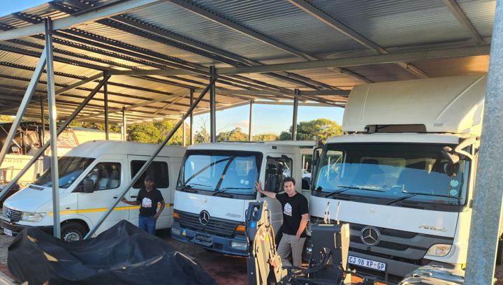 The Anchor Movers fleet under the carport
