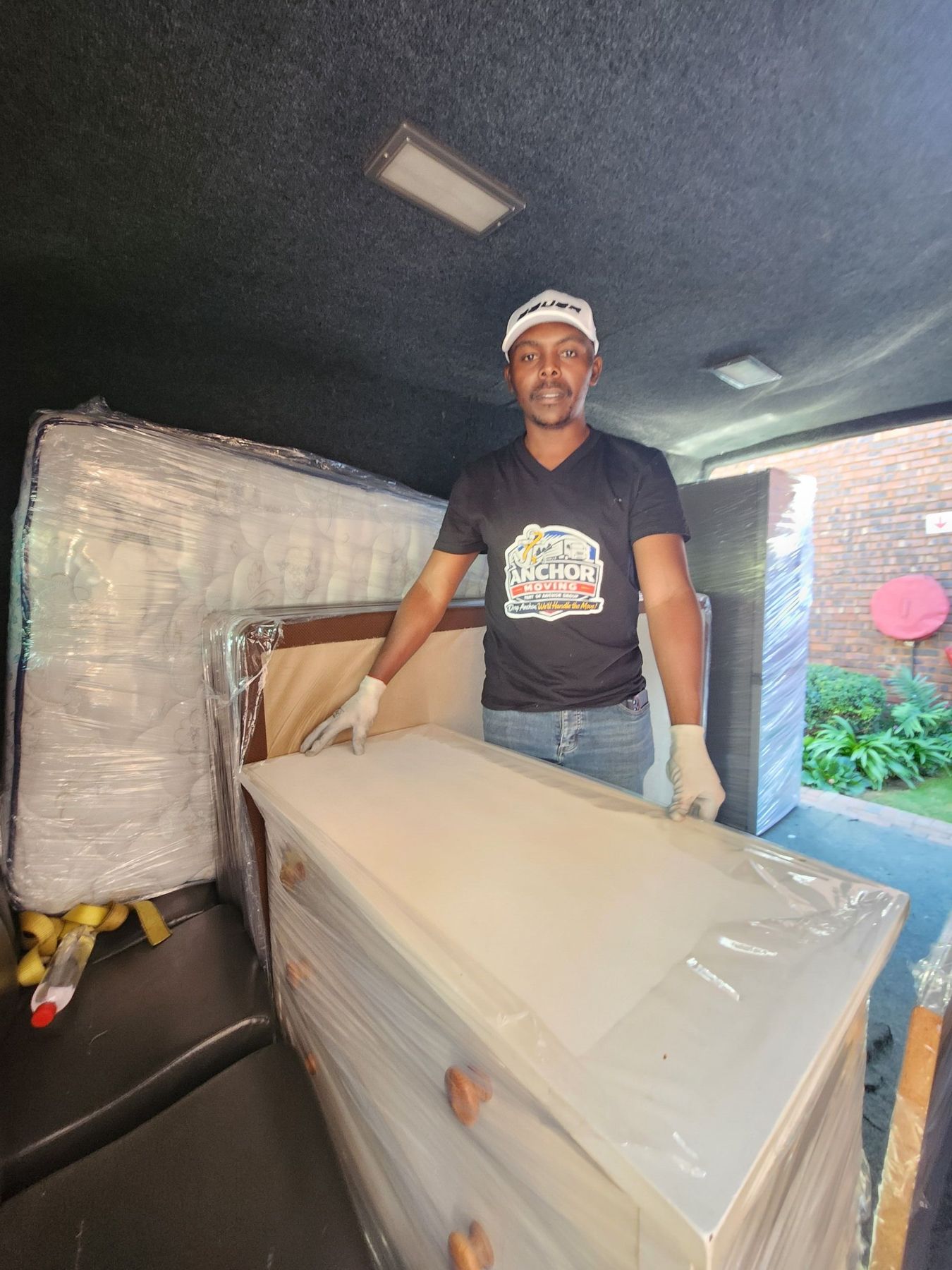 An Anchor Movers crew member handling a cabinet