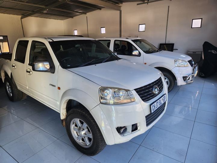 Company bakkies parked in the garage